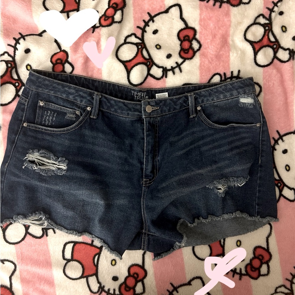 Dark blue ripped jean shorts with a high rise fit